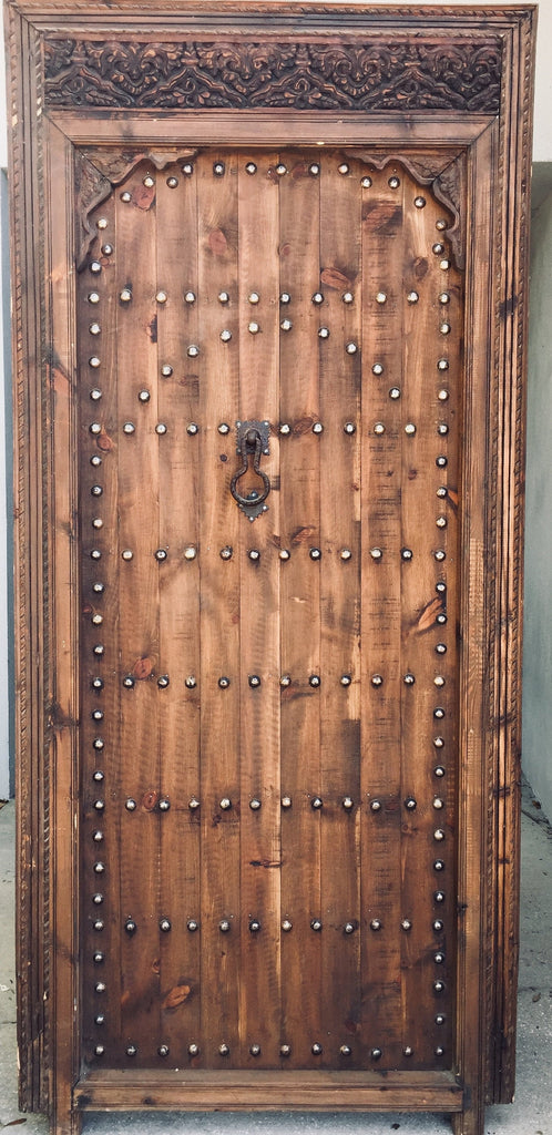 Vintage moroccan door handmade with metal knocker and umberella nail heads