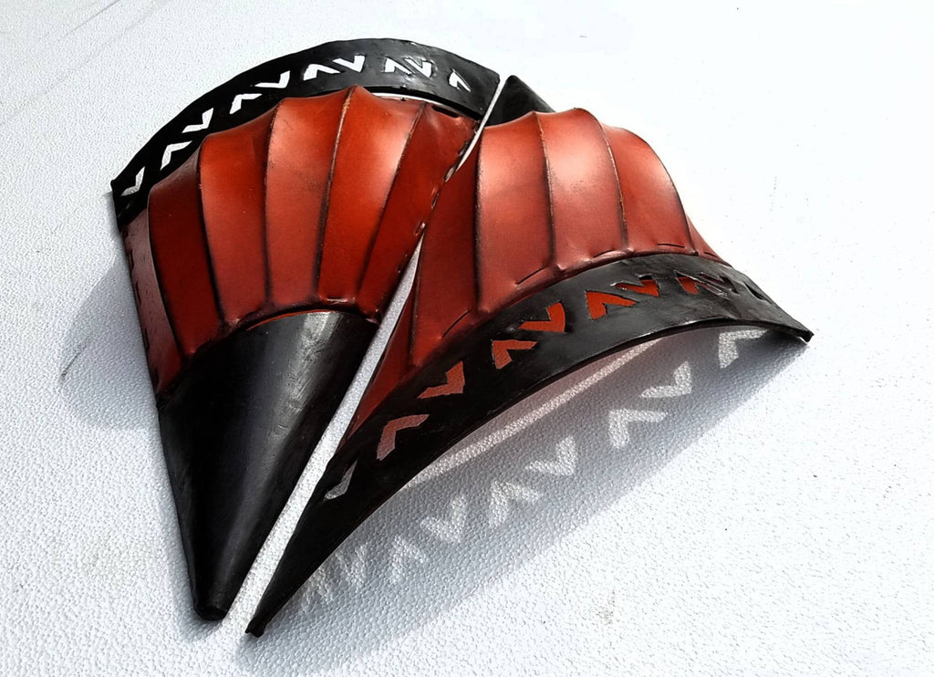 A pair of snail sconces handmade with a sea shell metal frame dyed with moroccan orange hide