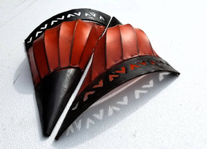 A pair of snail sconces handmade with a sea shell metal frame dyed with moroccan orange hide