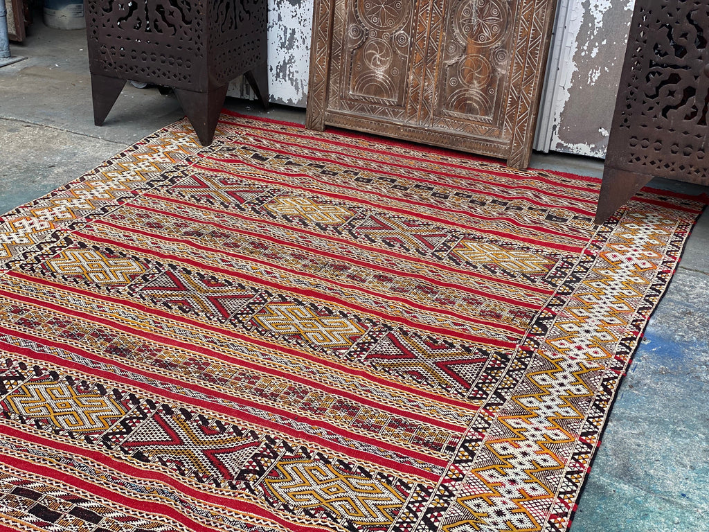 Rare red and gold kilim rug