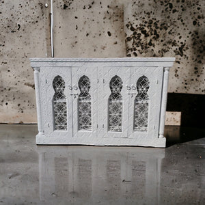 A wrought iron vanity sink cabinet