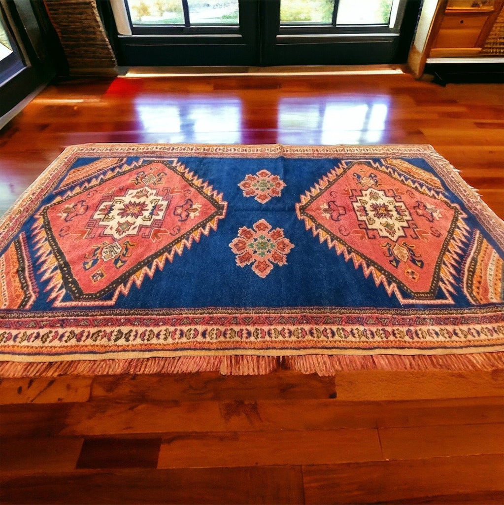 125” x 65” Dark orange and blue Vintage taznakht rug
